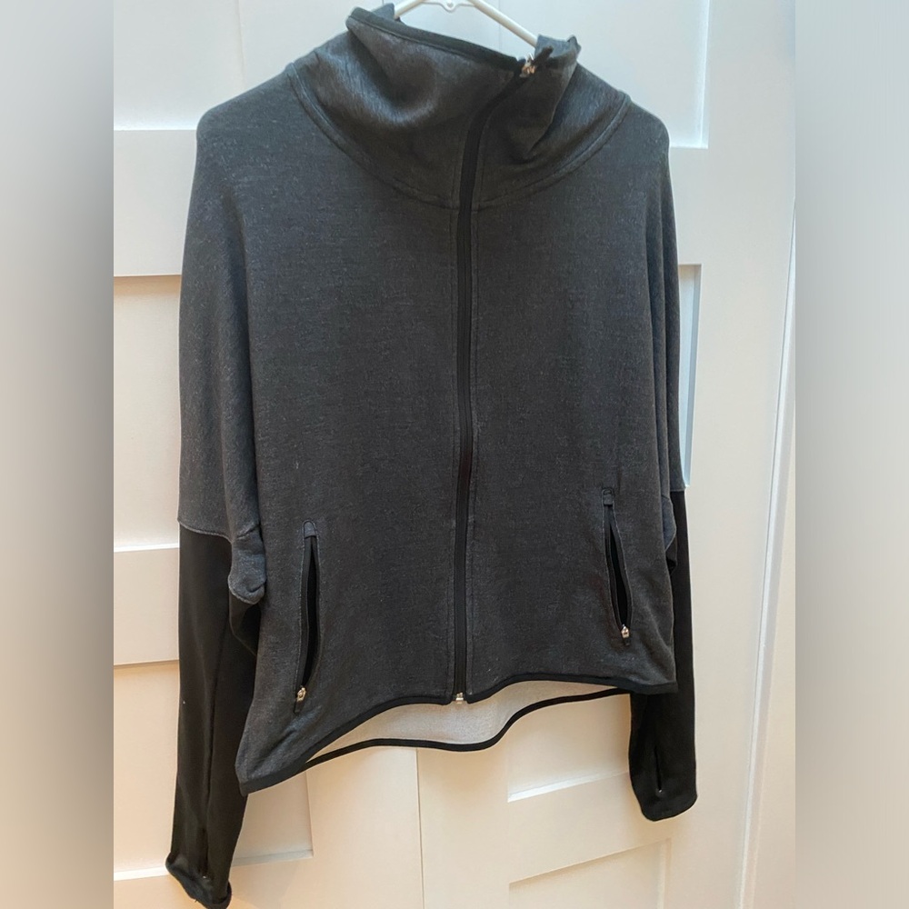 Nike jacket, size lg. Similar to a dolman fit tapered at the sleeves